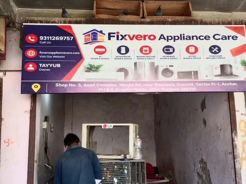 Owner of Fixvero Appliance Care repairing an AC unit at the shop