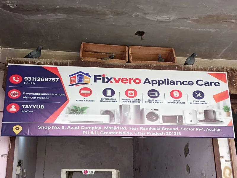 Fixvero Appliance Care store sign board with contact details